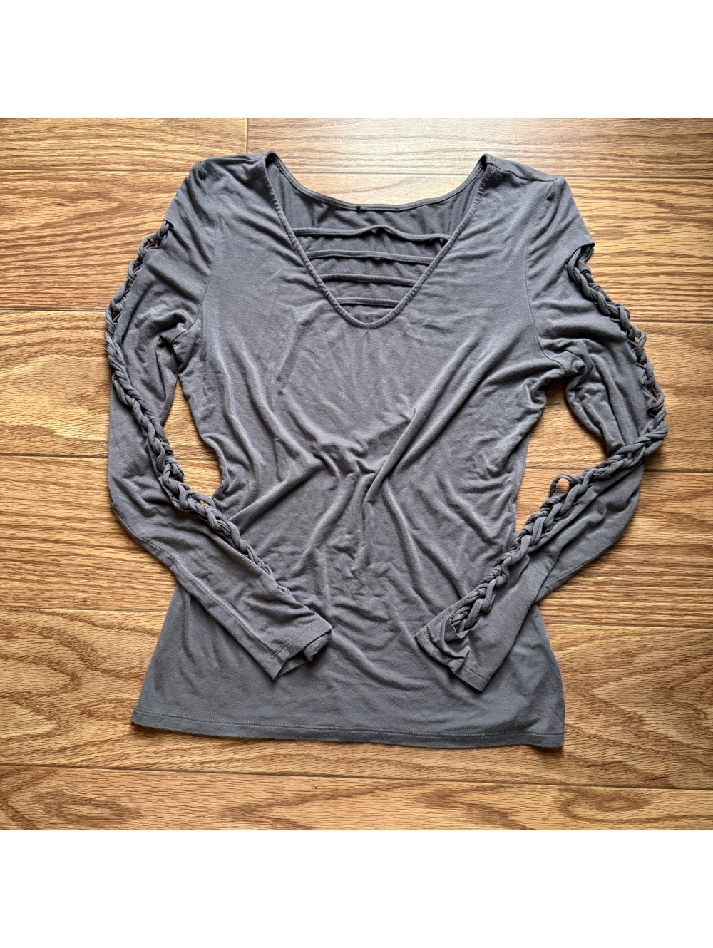 gray long sleeve top with lattice detail on sleeves and neckline